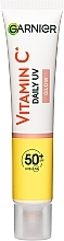 Дневной солнцезащитный флюид с витамином C для придания сияния коже лица, SPF50+ - Garnier Skin Naturals — фото N2