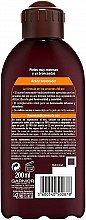 Інтенсивна кокосова олія для засмаги - Garnier Delial Ambre Solaire Intense Suntan Coco Oil — фото N2