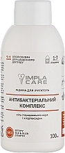ПОДАРУНОК! Рідина-концентрат для іригатора "Антибактеріальний комплекс" без фтору з сіллю стародавнього моря та хлоргексидином - ImplaCare — фото N1