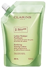 Тонизирующий лосьон с экстрактами таволги и гамамелиса - Clarins Purifying Toning Lotion (дой-пак) — фото N1