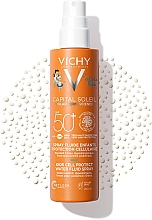 Солнцезащитный водостойкий спрей-флюид для чувствительной кожи детей, SPF50+ - Vichy Capital Soleil Kids Cell Protect Water Fluid Spray — фото N1
