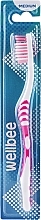 Зубна щітка середньої жорсткості, у блістері, рожева - Wellbee — фото N1