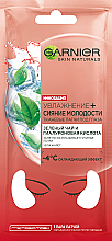 Духи, Парфюмерия, косметика Тканевые патчи под глаза "Увлажнение + Уход" с экстрактом зеленого чая и гиалуроновой кислотой - Garnier Skin Naturals Hydra Bomb Eye Tissue Mask