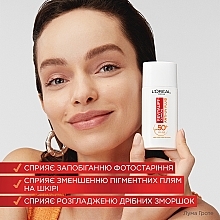 Флюид с витамином С для защиты лица SPF 50+ - L'Oreal Paris Revitalift Clinical SPF50+ Anti-UV Fluid — фото N4