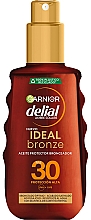 Солнцезащитное масло-спрей - Garnier Delial Ambre Solaire Ideal Bronze Protective Oil Spray SPF30 — фото N1