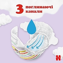 Подгузники на липучках Ultra Comfort M-Pack 4 (7-18 кг), 132 шт. - Huggies — фото N3