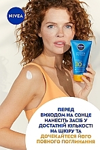 УЦІНКА Сонцезахисний крем-гель "Захист та сухий дотик" SPF 30 - NIVEA SUN Protect & Dry Touch * — фото N8