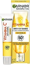 Дневной солнцезащитный флюид с витамином С - Garnier SkinActive Invisible Anti-Spot With Vitamin C SPF 50+ — фото N1