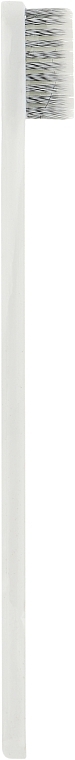 Зубная щетка средней жесткости в картонной упаковке, бело-черная - Happy Dent — фото N1