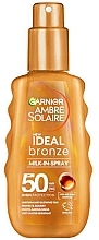 Солнцезащитное молочко - Garnier Ambre Solaire Ideal Bronze Milk-In-Spray SPF50 — фото N1