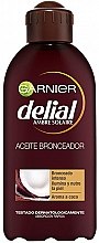 Інтенсивна кокосова олія для засмаги - Garnier Delial Ambre Solaire Intense Suntan Coco Oil — фото N1