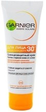 Духи, Парфюмерия, косметика Солнцезащитный крем для лица SPF30 - Garnier Ambre Solaire