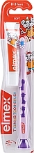 Парфумерія, косметика Дитяча зубна щітка м'яка (0-3 років), бузкова з жирафом - Elmex Learn Toothbrush Soft + Toothpaste 12ml
