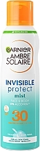 Сонцезахисний освіжаючий водостійкий спрей-вуаль для шкіри тіла та обличчя, високий ступінь захисту SPF30 - Garnier Ambre Solaire Invisible Protect Mist — фото N1