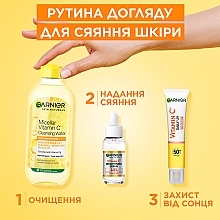 Дневной солнцезащитный флюид с витамином C для придания сияния коже лица, SPF50+ - Garnier Skin Naturals — фото N13