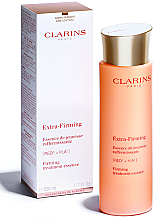 Укрепляющая лечебная эссенция - Clarins Extra-Firming Essense  — фото N1