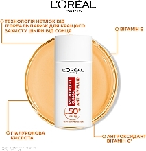 Флюид с витамином С для защиты лица SPF 50+ - L'Oreal Paris Revitalift Clinical SPF50+ Anti-UV Fluid — фото N7