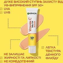 Cонцезахисний денний флюїд з вітаміном С для надання сяяння шкірі обличчя, SPF50+ - Garnier Skin Naturals — фото N9