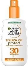 Солнцезащитный водостойкий спрей против сухости кожи и лица с высокой степенью защиты - Garnier Ambre Solaire Hydra 24 SPF30 — фото N1